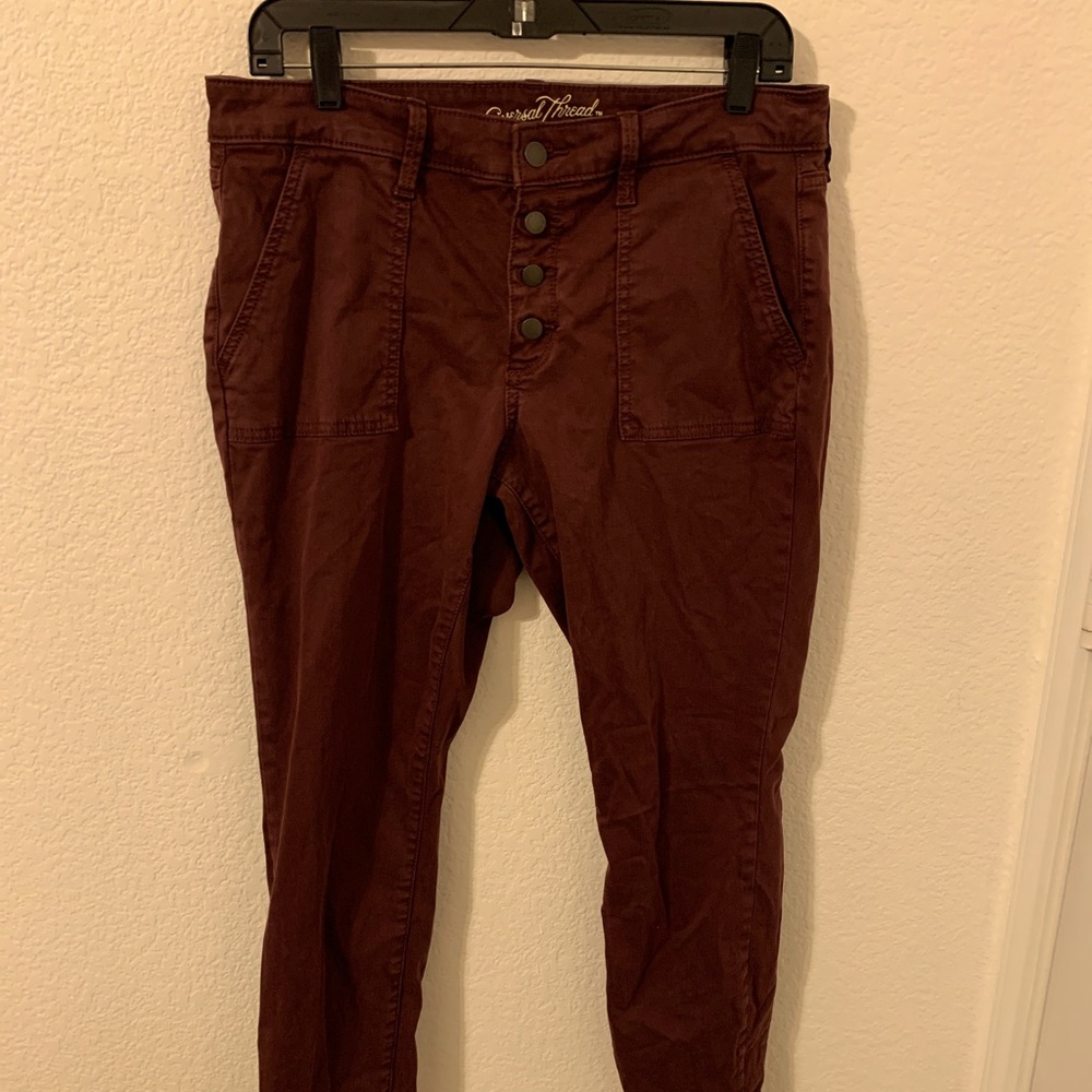 Pale burgundy skinny jeans